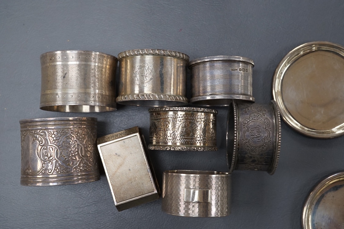 A pair of 19th century tripod salts, height 60mm, together with eight assorted silver napkin rings and a pair of small Victorian silver coasters?, 16.5oz.